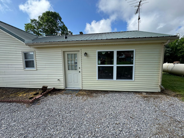 New-windows-replacing-an-old-rotten-door New windows and siding work where the old rotten door had been