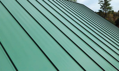 Standing-seam-metal-roofing Closeup of green standing seam metal roofing